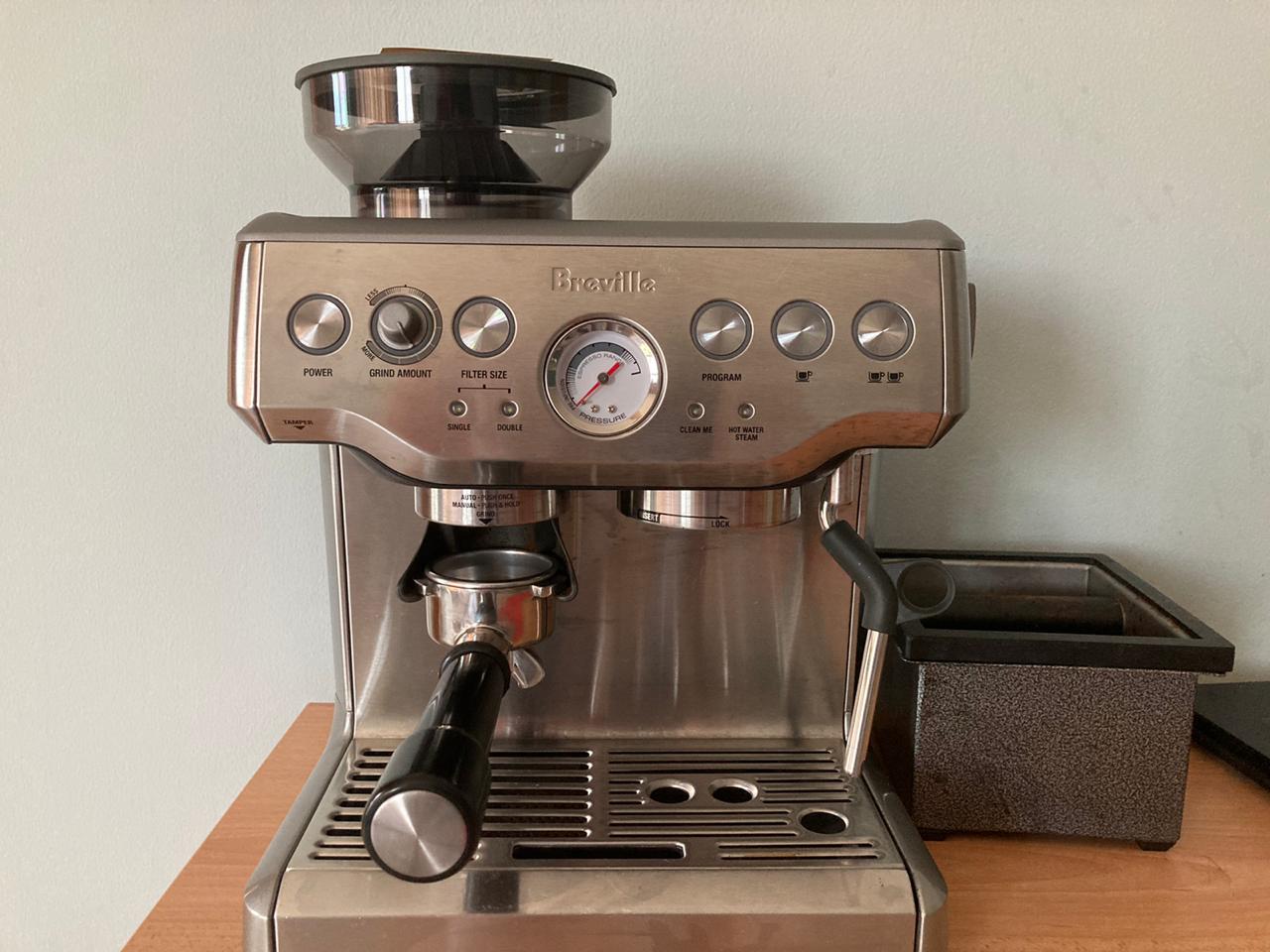 A picture of the Barista Express, with a knock box on the right